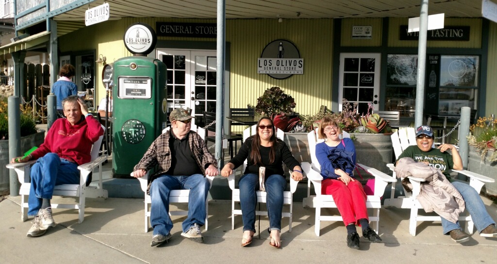 Three CIP Tour members sitting in chairs in Los Olivos