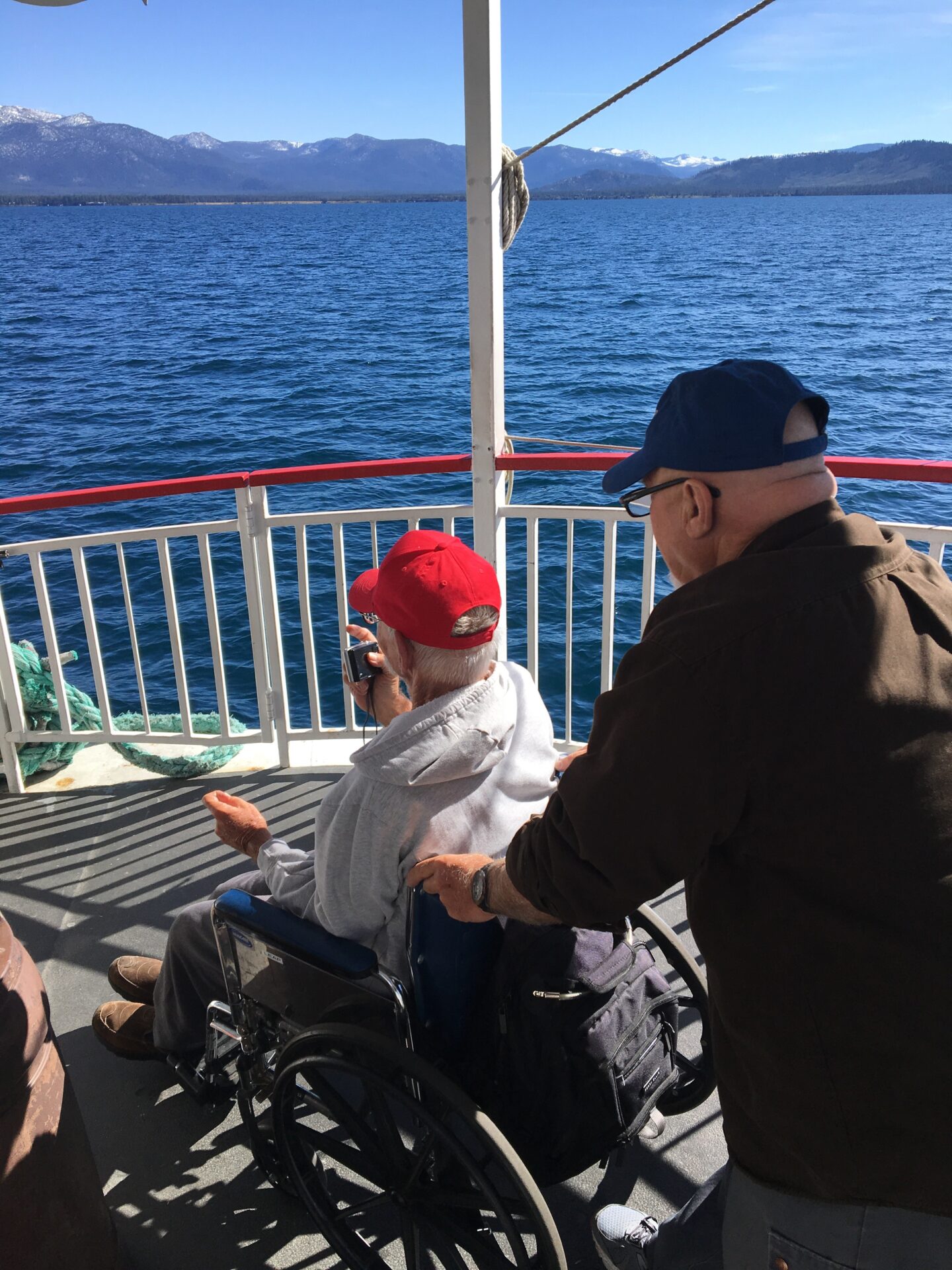 A UCP Member and UCP Volunteer on a boat on Lake Tahoe looking into the horizon