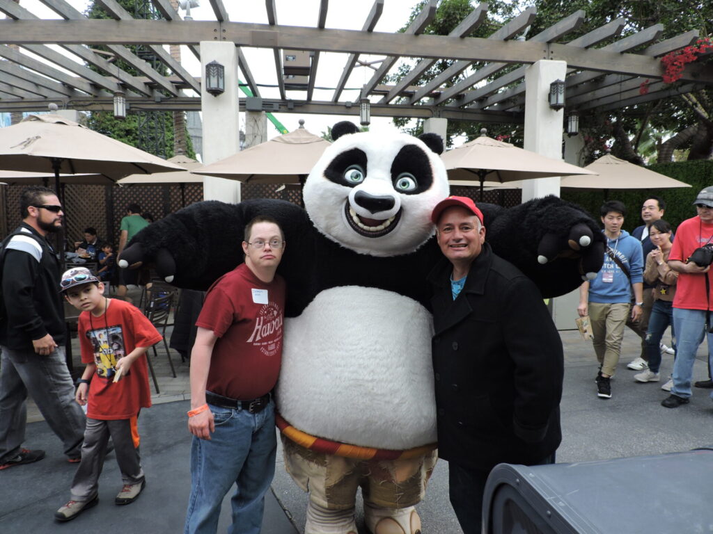 Two UCP Members posing with a character from Universal Studios