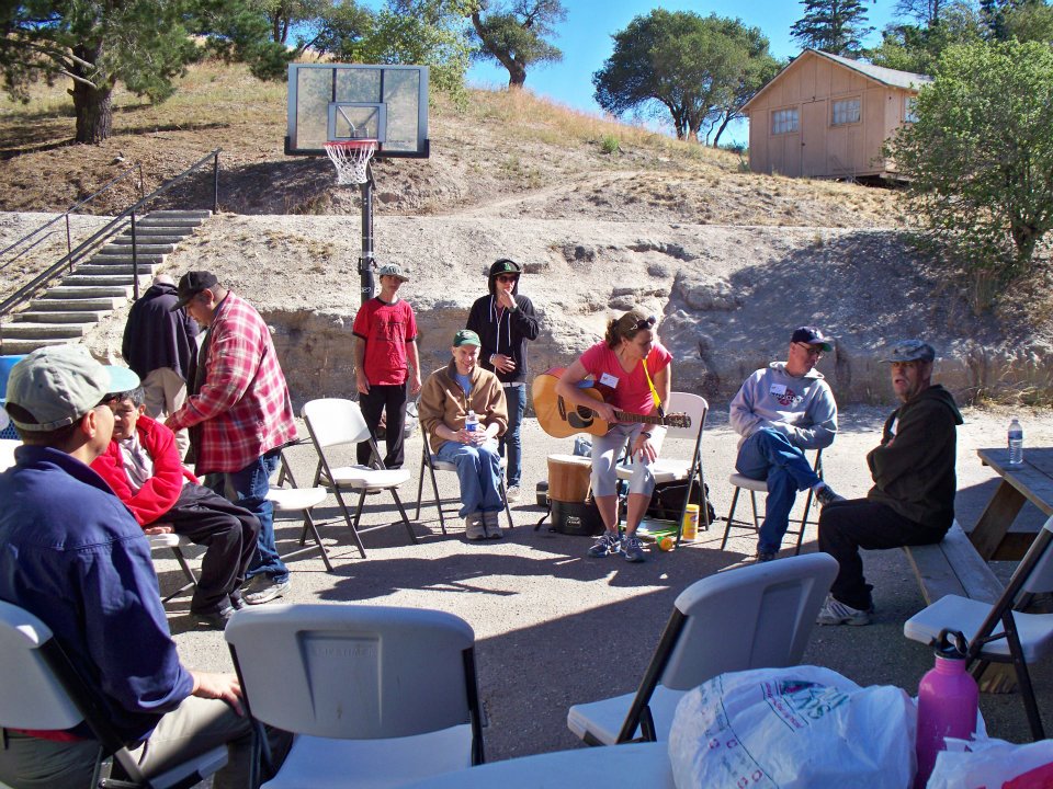 UCP Members at a music circle at Camp Kelley Creek